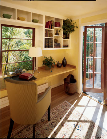 Kelly’s first project was turning this front bedroom into a home office. She made a built-in desk from bamboo plywood and new wall shelves of formaldehyde-free Medite medium-density fiberboard. Here, too, she began to experiment with wall finishes; over a coat of light-colored acrylic paint she used a dry brush to apply tinted acrylic glaze. Salvaged French doors open the room to the cozy front patio.